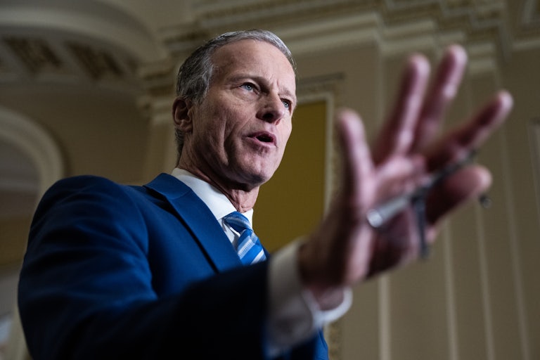 Senate Majority Leader John Thune speaks and makes a hand gesture while in the U.S. Capitol