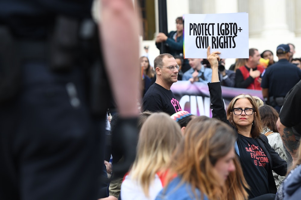 Demonstrators in favor of LGBTQ rights rally outside the US Supreme Court in Washington, DC