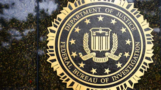 fbi logo on doj building