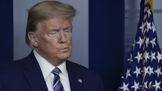 President Trump listens during a briefing at the White House.