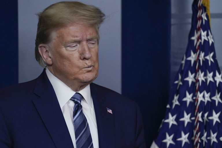 President Trump listens during a briefing at the White House.
