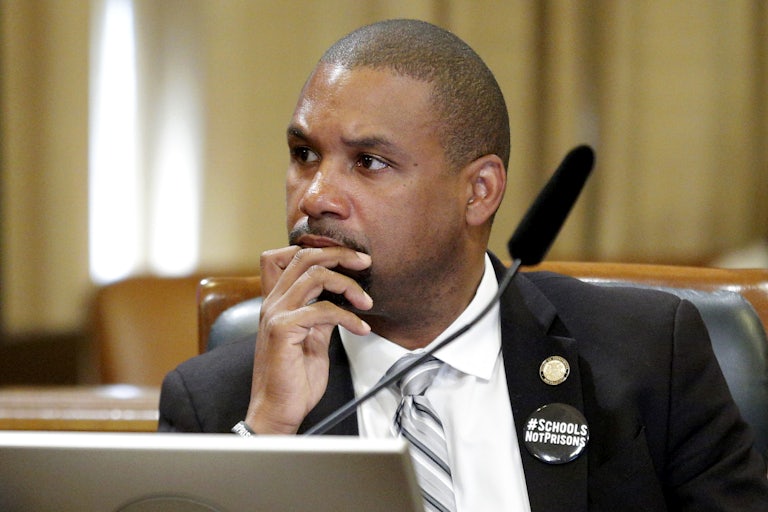 Shamann Walton seated with a mic before him