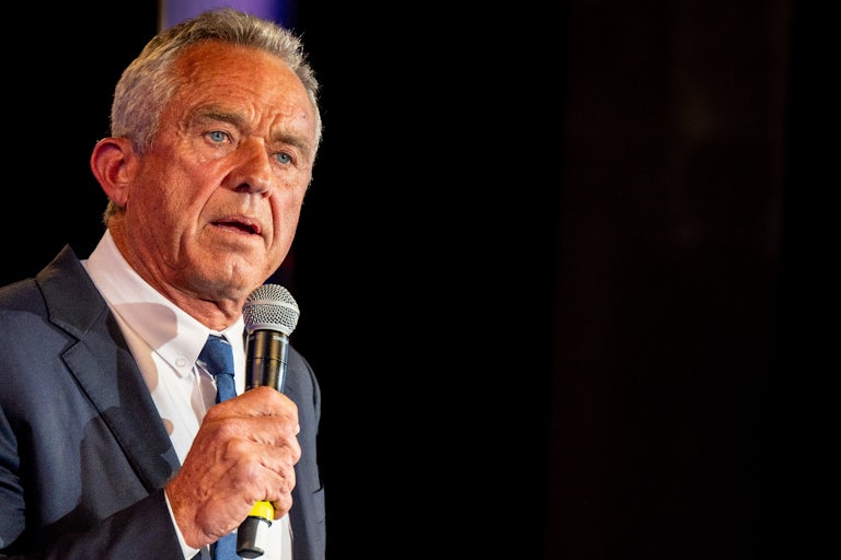 Robert F. Kennedy Jr. speaking with a mic in his hand