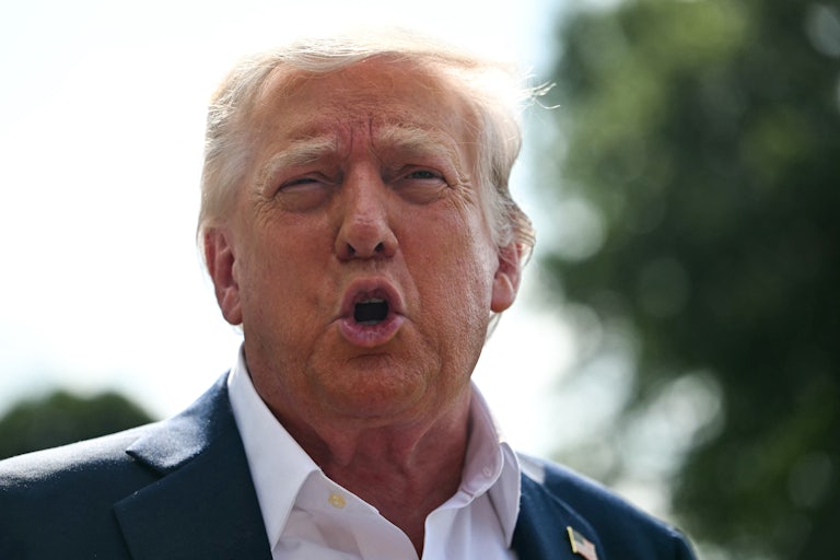 Donald Trump speaks to reporters outside the White House