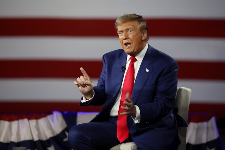 Donald Trump speaks and makes hand gestures