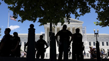 Capitol Police officers observe an abortion rights protest outside of the U.S. Supreme Court Building on June 24.