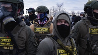 Masked federal immigration agents in Minneapolis, Minnesota