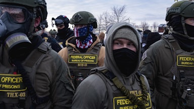 Masked federal immigration agents in Minneapolis, Minnesota