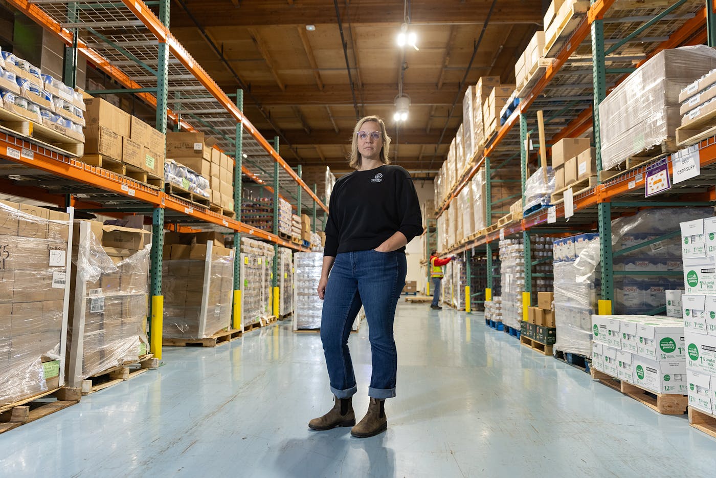 Rachael Miller, chief advocacy officer of the Food Bank of Alaska, at the organization’s Anchorage warehouse
