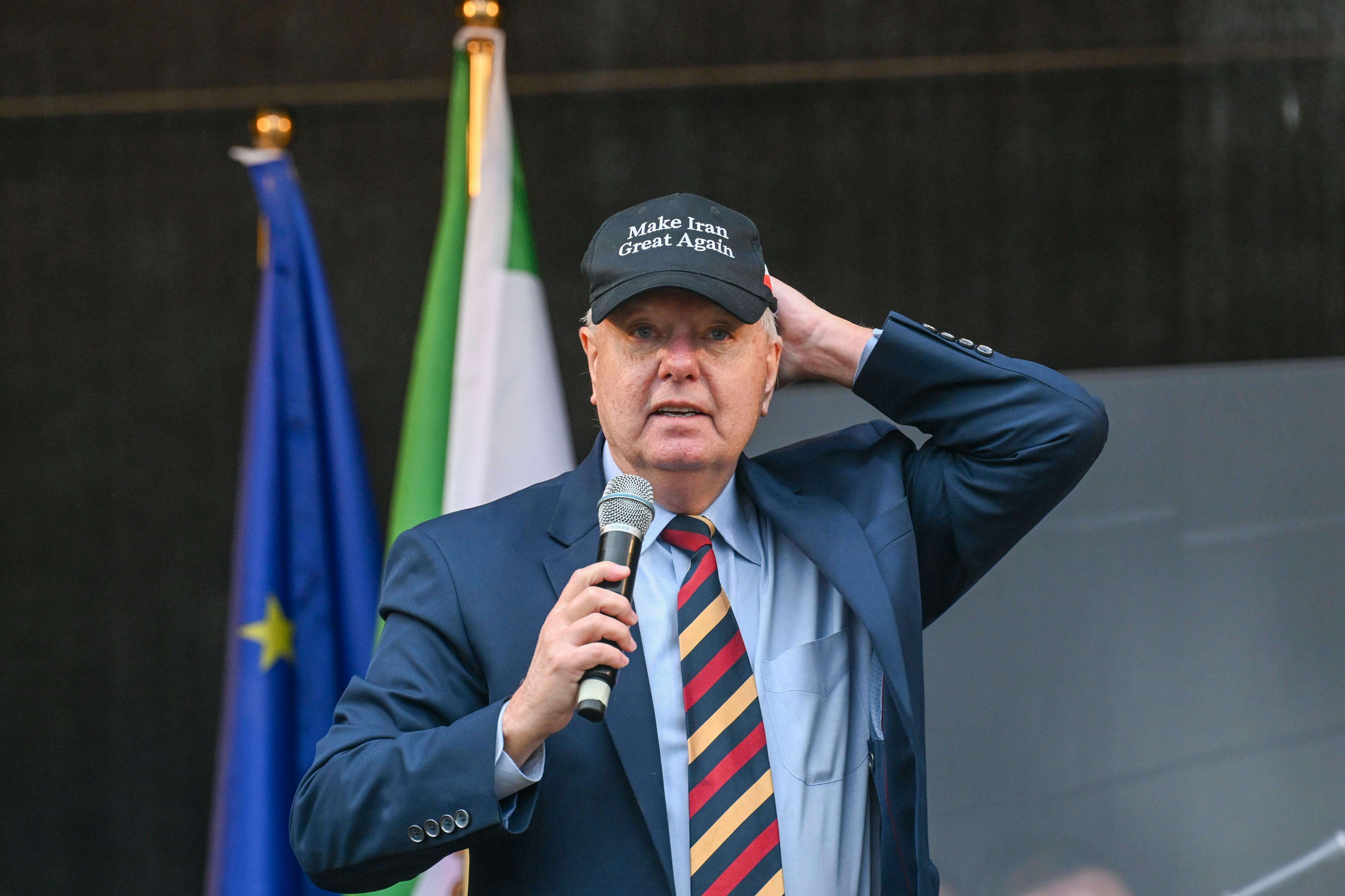 Lindsey Graham wears a Make Iran Great Again hat in February