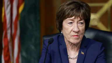 Senator Susan Collins stares listlessly