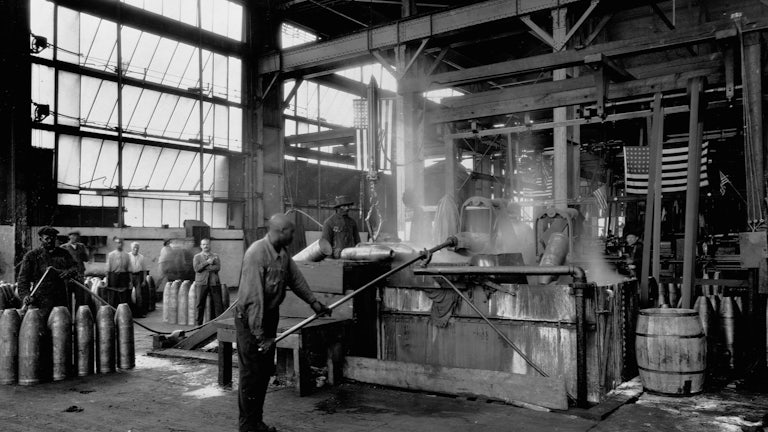 Men make munitions for World War I on the factory floor of Oakley Chemical Company.