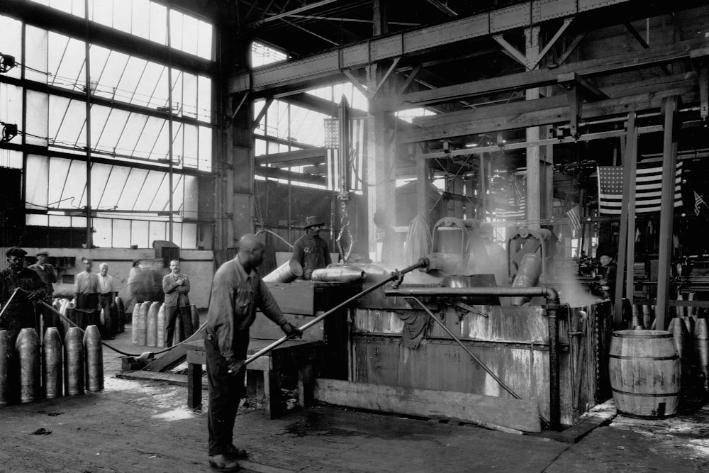 Men make munitions for World War I on the factory floor of Oakley Chemical Company.