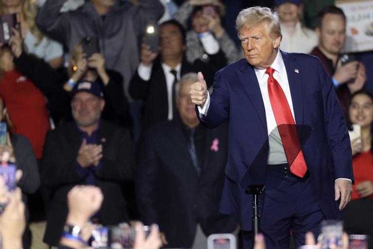 Donald Trump gives the thumbs-up while on stage