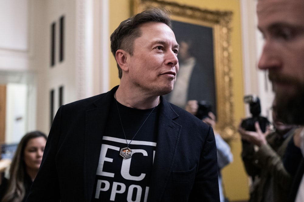 Elon Musk walks in the Capitol