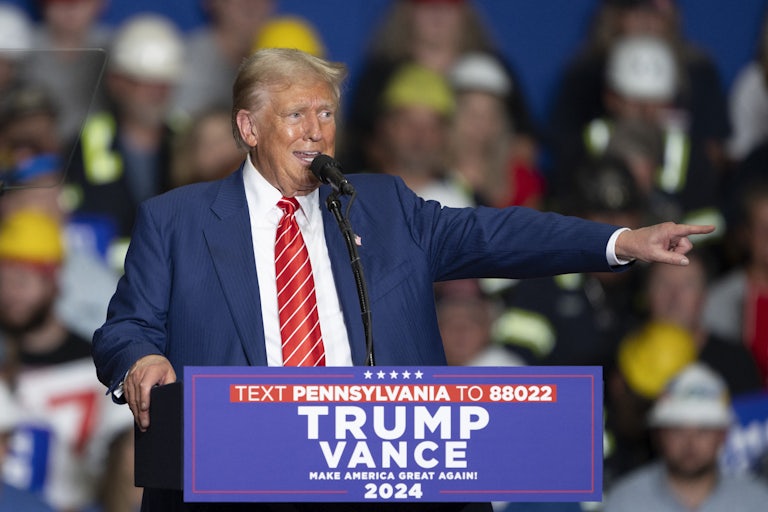 Donald Trump points while speaking at a campaign event