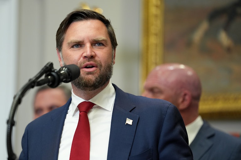 Vice President JD Vance speaking into a mic