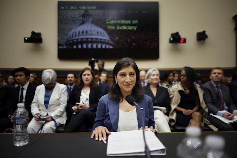 FTC Chair Lina Khan smiles in a House Judiciary Committee hearing