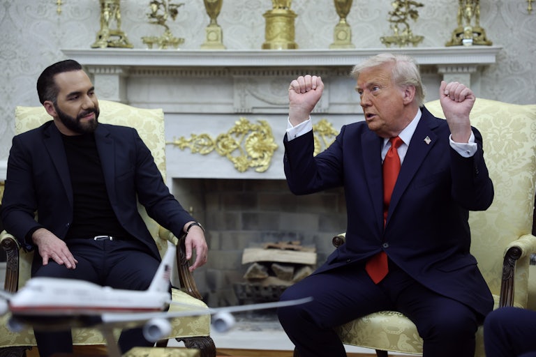 Salvadoran President Nayib Bukele sits next to Donald Trump in the Oval Office. Trump raises his fists above his head