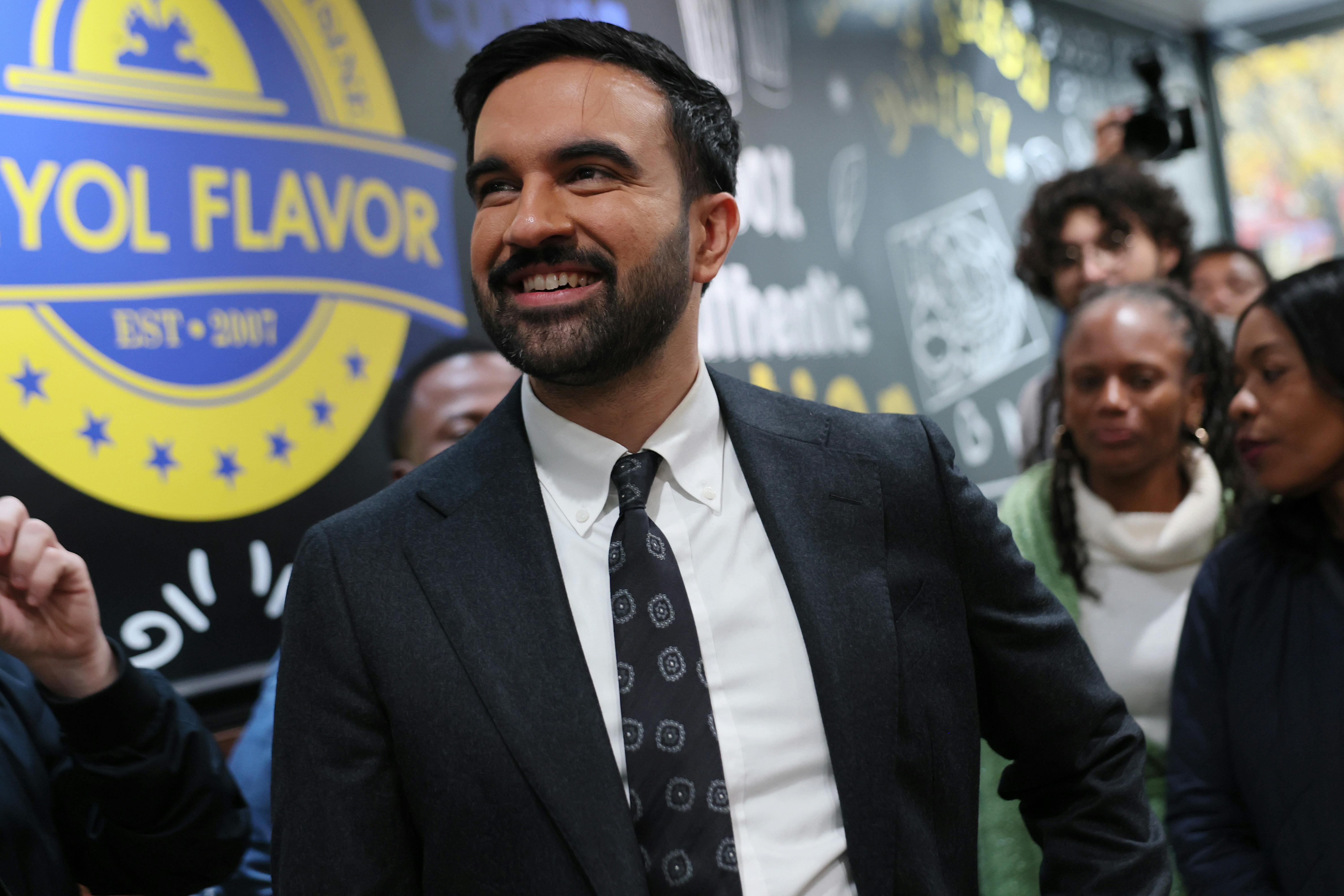 Democratic Mayoral Candidate Zohran Mamdani looks at the menu inside of Kreyol Flavor in the East Flatbush neighborhood of New York City. 