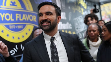 Democratic Mayoral Candidate Zohran Mamdani looks at the menu inside of Kreyol Flavor in the East Flatbush neighborhood of New York City.