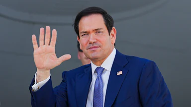 Secretary of State Marco Rubio waves
