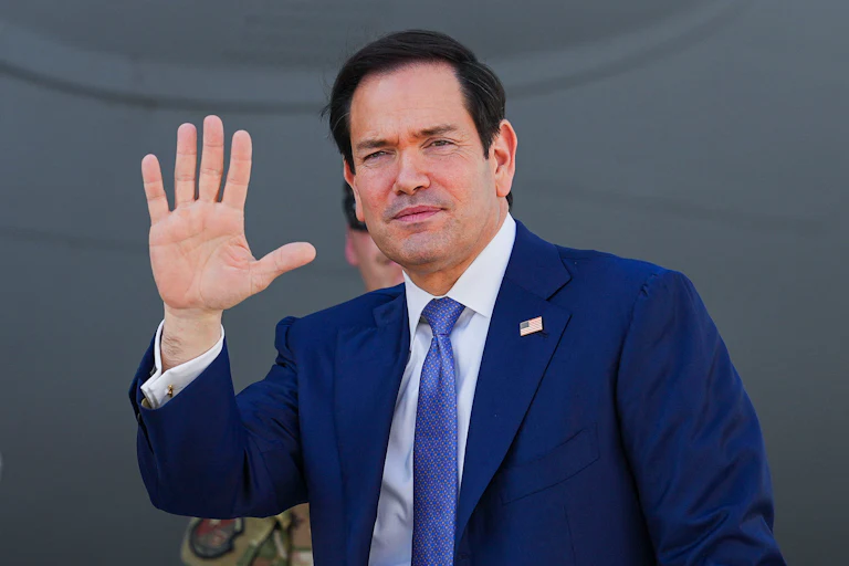 Secretary of State Marco Rubio waves