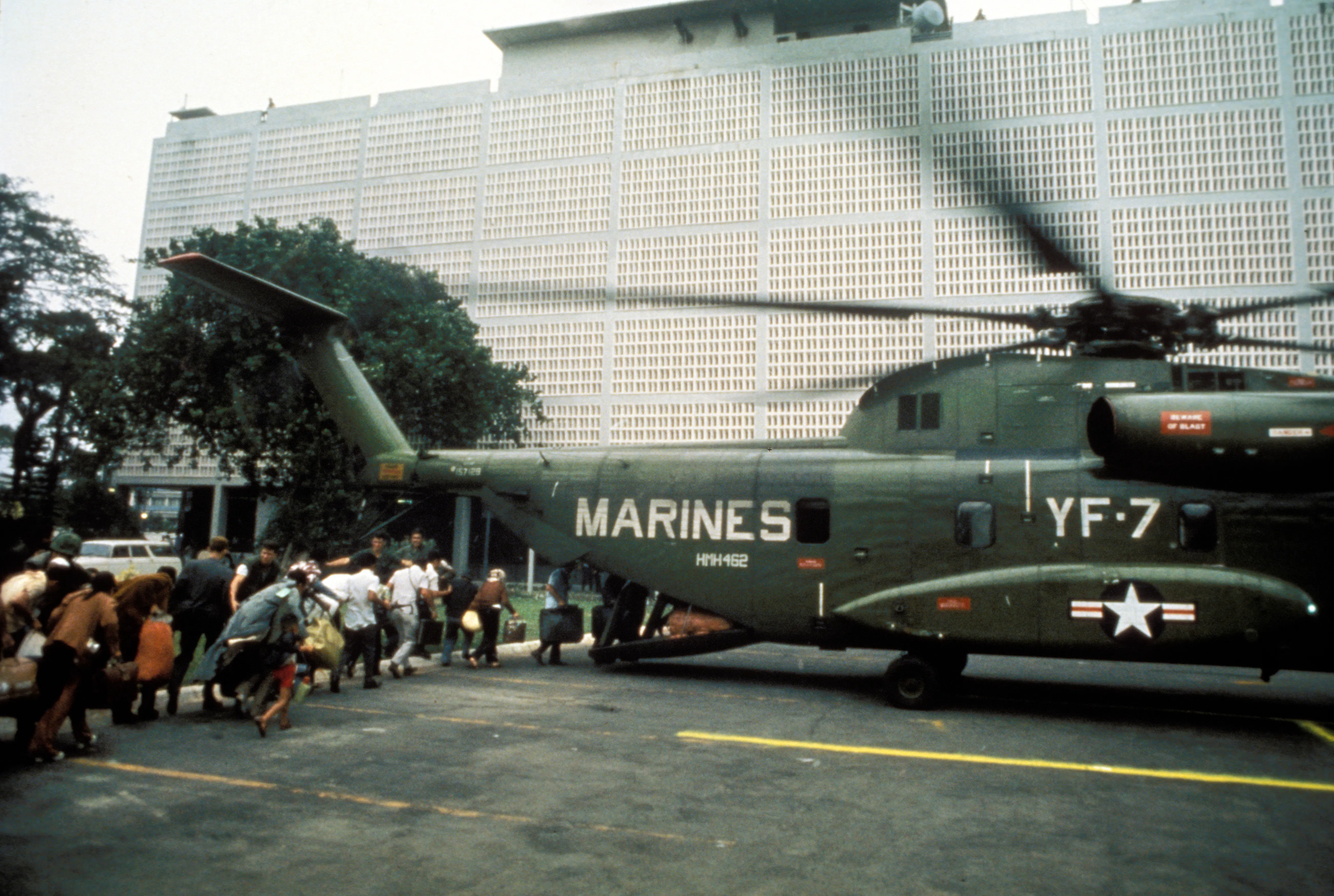 Civilian evacuees board a US Marine helicopter inside US Embassy in Saigon on April 30th 1975 
