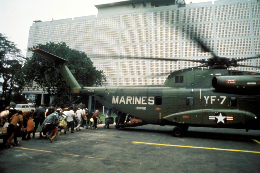Civilian evacuees board a US Marine helicopter inside US Embassy in Saigon on April 30th 1975
