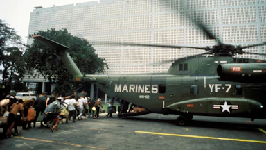 Civilian evacuees board a US Marine helicopter inside US Embassy in Saigon on April 30th 1975
