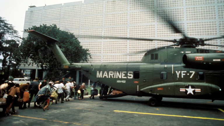 Civilian evacuees board a US Marine helicopter inside US Embassy in Saigon on April 30th 1975