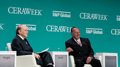Daniel Yergin and Tellurian CEO Charif Souki smile while seated.