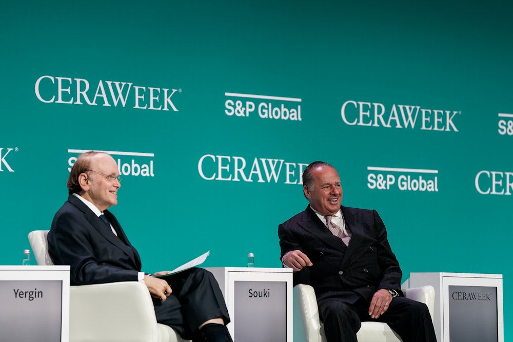 Daniel Yergin and Tellurian CEO Charif Souki smile while seated.
