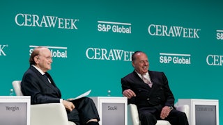 Daniel Yergin and Tellurian CEO Charif Souki smile while seated.