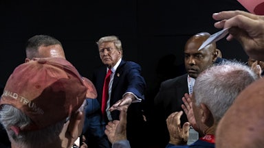 Photograph of Trump reaching out his hand to supporters below him at the Republican National Convention, that is composed like many artistic renderings of Jesus. This convention, Trump has cast himself as a Christ-like savior