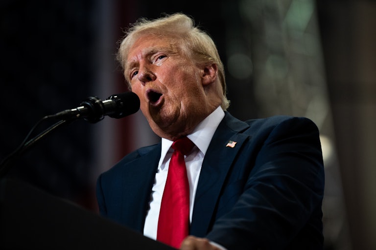 Donald Trump yells into a mic