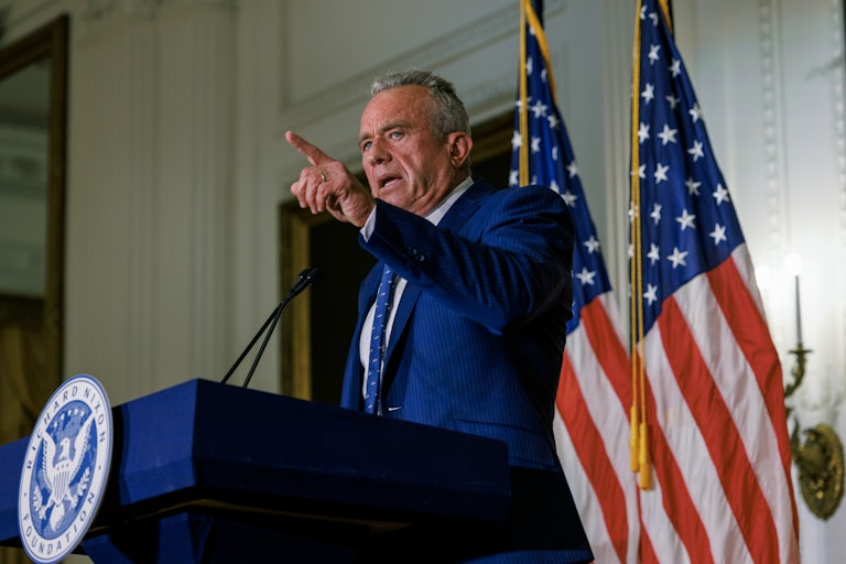 Robert F. Kennedy Jr. gestures as he speaks at a podium