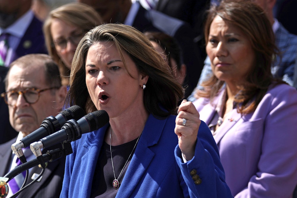 Rep. Angie Craig, ranking member of the House Agriculture Committee, speaks at a press conference flanked by her fellow Democrats.