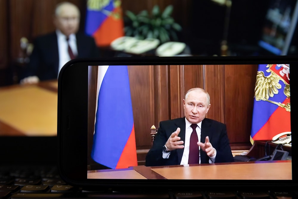 A screen displaying Russian President Vladimir Putin speaking during a televised address to the Russian people.