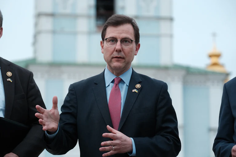 Representative Thomas Kean Jr. speaks while making hand gestures