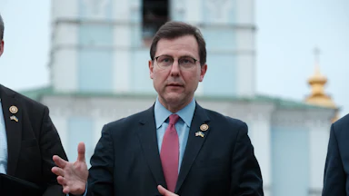 Representative Thomas Kean Jr. speaks while making hand gestures