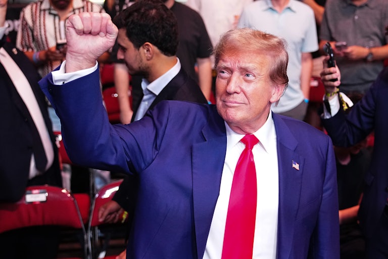 Donald Trump holds up his fist