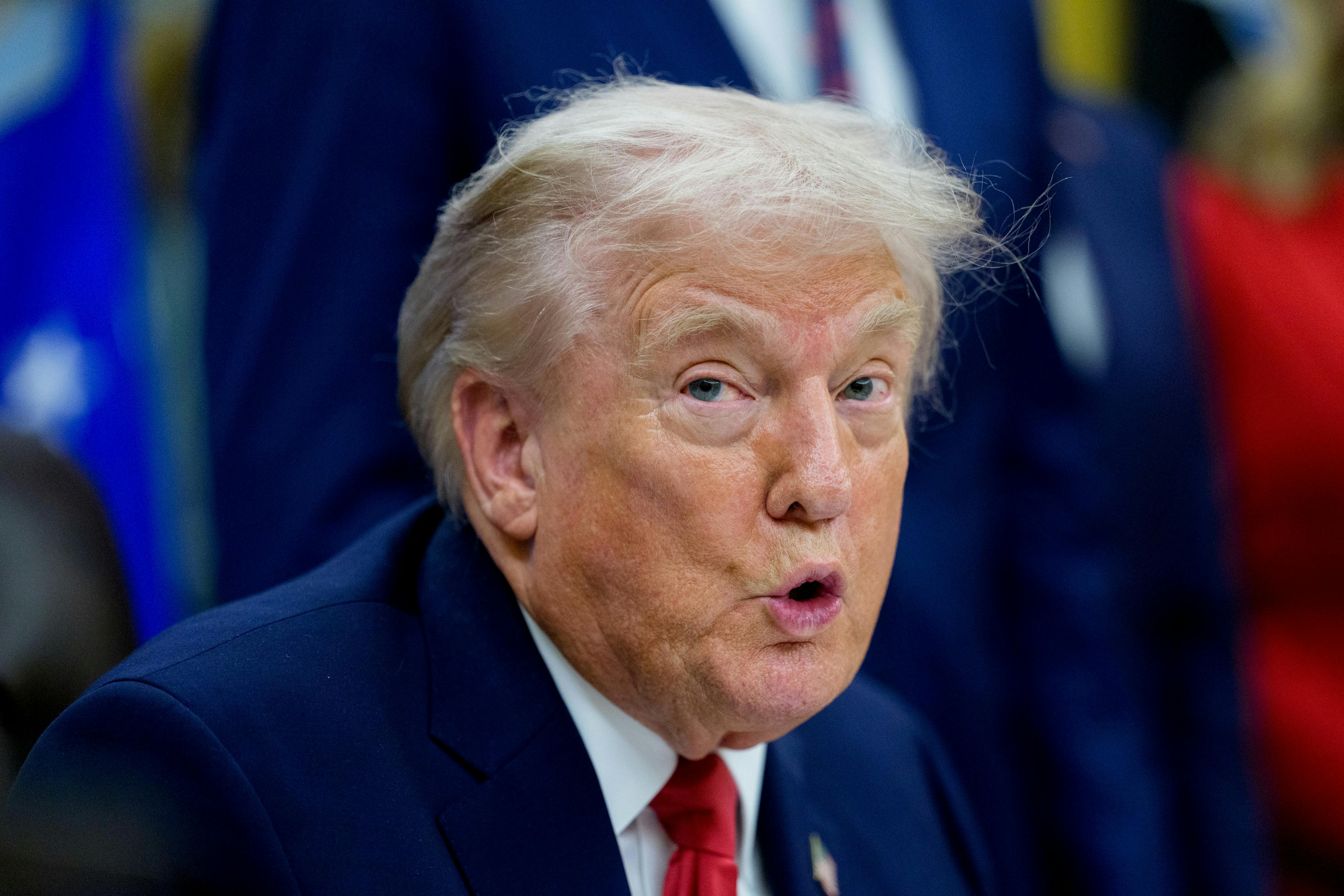 Donald Trump speaks during an announcement in the Oval Office.