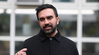 Zohran Mamdani speaks at a lectern.