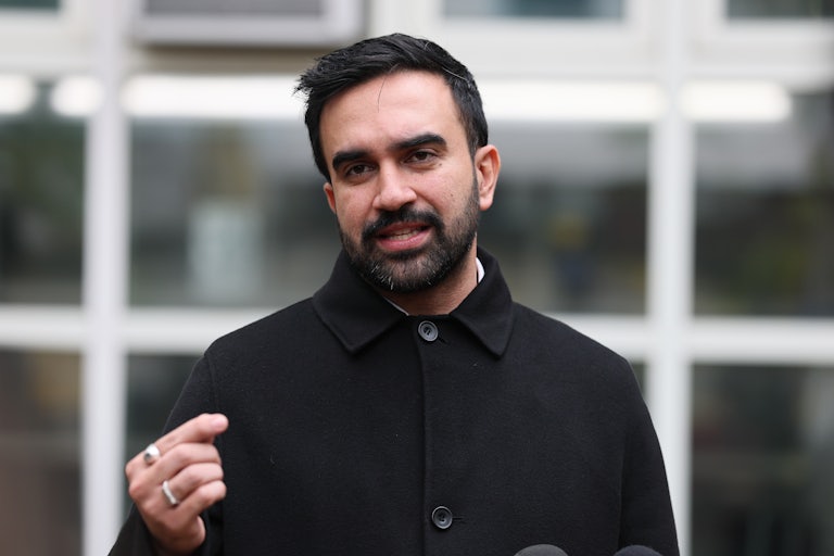 Zohran Mamdani speaks at a lectern.