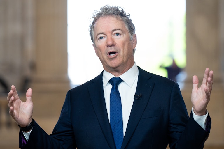 Senator Rand Paul gestures while speaking during a TV interview