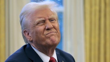 Donald Trump frowns while speaking to reporters in the Oval Office