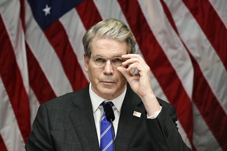 Treasury Secretary Scott Bessent adjusts his glasses