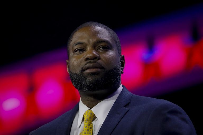 Representative Byron Donalds looks off camera