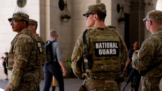 Members of the National Guard stand outside Union Station in Washington, D.C.